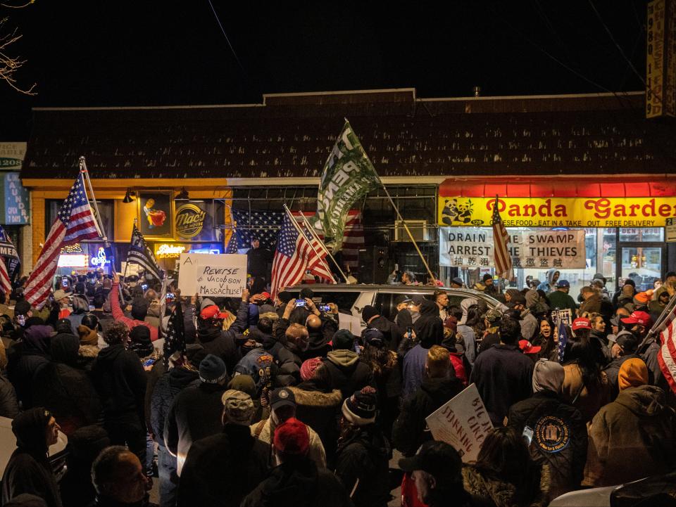 People protest outside of the Mac’s Public House after closed it down as the Covid-19 pandemic in the Staten Island borough of New York City, on 2 December 2020 ((Reuters - Jeenah Moon))