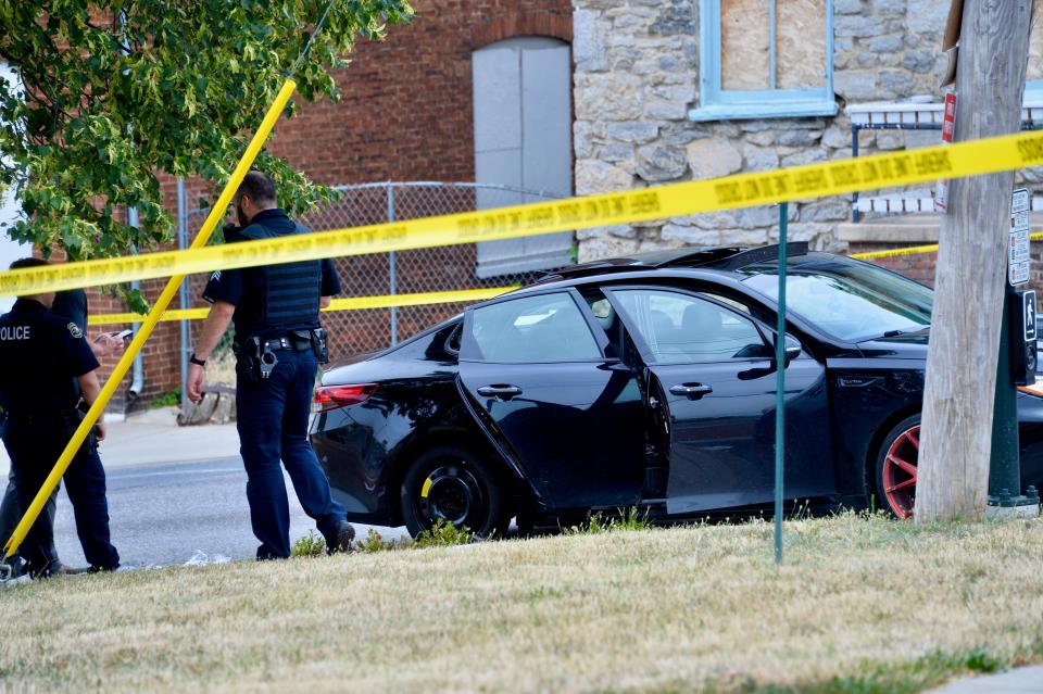 Police were checking out a car at the corner of East Washington Street and Cannon Avenue early Thursday afternoon after a shooting in the area.