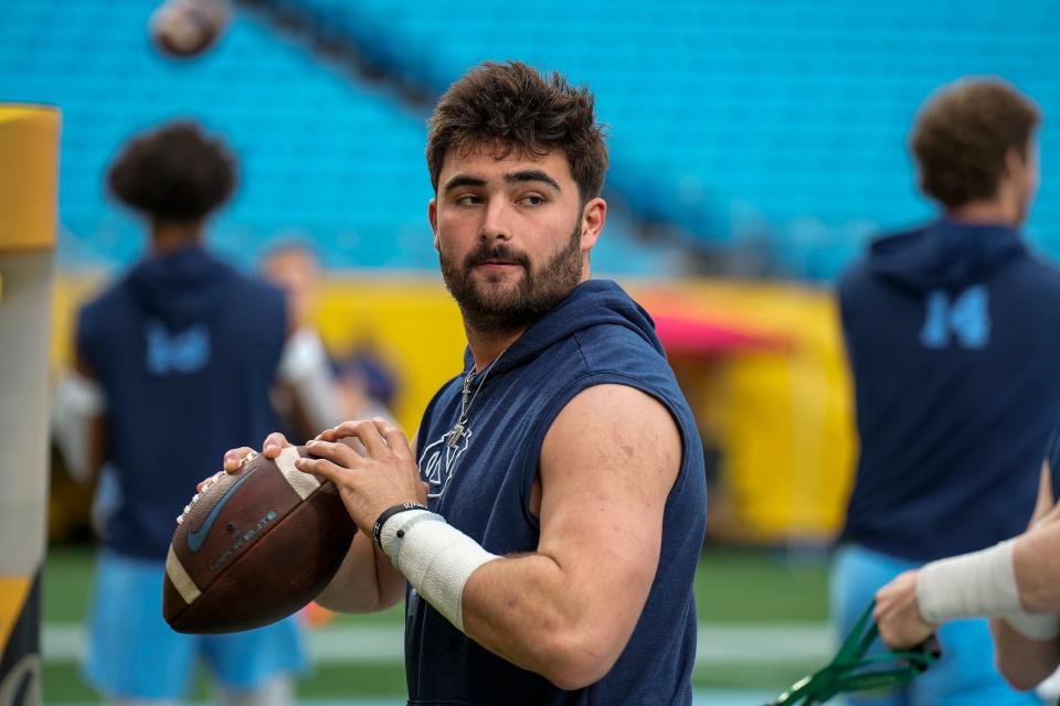 North Carolina quarterback Sam Howell warms up in December before the Duke’s Mayo Bowl at Bank of America Stadium in Charlotte.