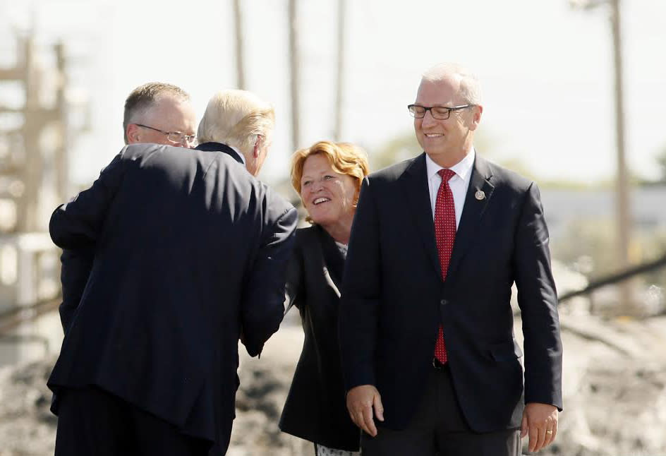 Sen. Heidi Heitkamp shakes the hand of President Donald Trump with other state leaders including Kevin Cramer to her right on Sept. 6, 2017, at the Tesoro Refinery in Mandan, N.D. (Photo: Michael Vosburg / The Forum)