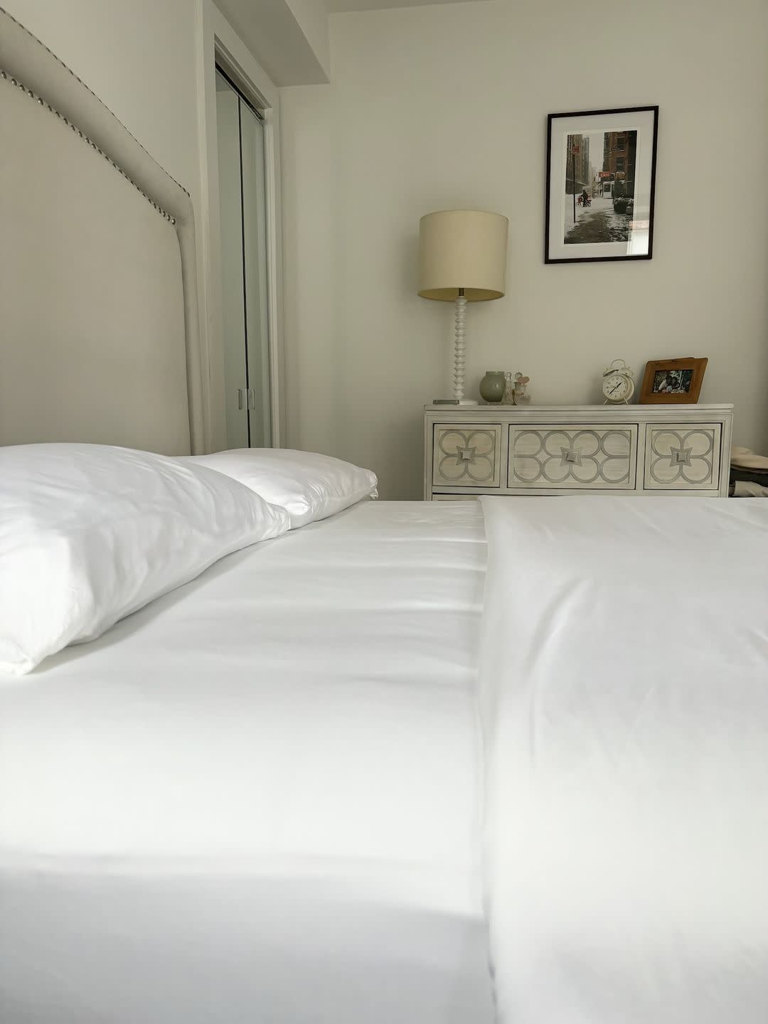 a bed with white sheets