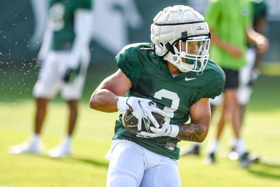 Michigan State running back Jaelon Barbarin runs after a catch during football practice on Wednesday, Aug. 9, 2023, in East Lansing.