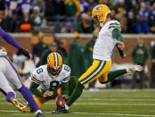 Green Bay Packers kicker Mason Crosby (2) kicks a 40 yard filed goal as punter Tim Masthay (8) holds against the Minnesota Vikings in the second quarter at TCF Bank Stadium. Mandatory Credit: Bruce Kluckhohn-USA TODAY Sports