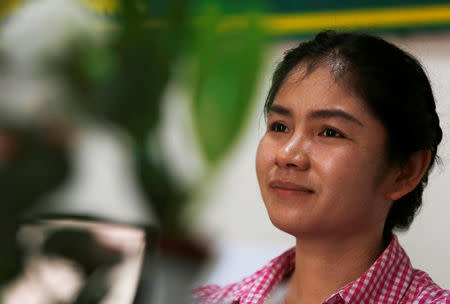 O'Cha Commune chief from opposition party Cambodia National Rescue Party (CNRP) Sin Rozeth, smiles during an interview with Reuters at her office in Battambang province, Cambodia, October 11, 2017. Picture taken on October 11, 2017. REUTERS/Samrang Pring