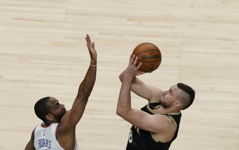 Atlanta Hawks' Danilo Gallinari (8) shoots and is fouled by New York Knicks' Alec Burks during the first half in Game 4 of an NBA basketball first-round playoff series Sunday, May 30, 2021, in Atlanta. (AP Photo/Brynn Anderson)