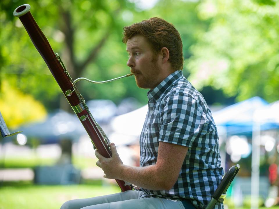 Bassoonist Justin Cummings performs during the Music at the Market concert in Walter Hardy Park on Sunday, June 5, 2022. Performed by Knoxville Symphony Orchestra musicians, the concert was held to raise funds for the Austin-East Foundation. 