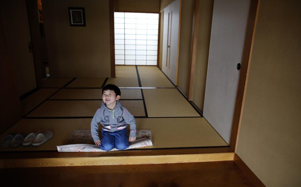 Five-year-old Atsunori Kaneta smiles at his home in Koriyama, west of the tsunami-crippled Fukushima Daiichi nuclear power plant, Fukushima prefecture February 28, 2014. (EUTERS/Toru Hanai)