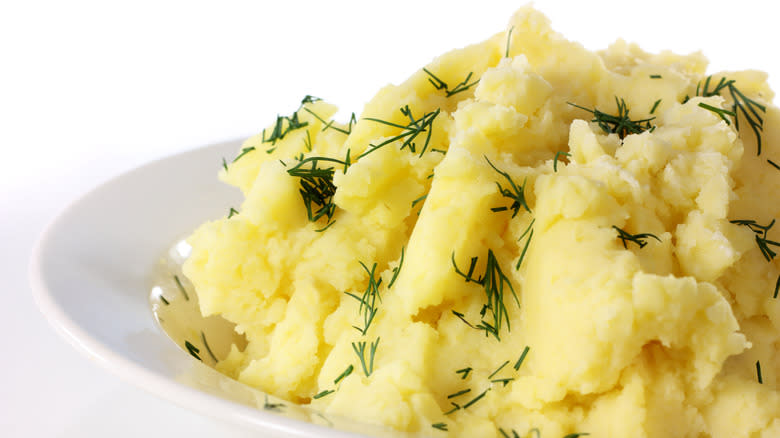Plate of mashed potatoes with herbs