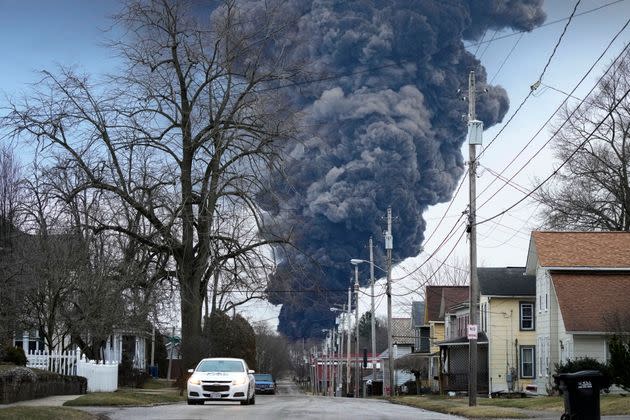 A black plume rises over East Palestine, Ohio, on Feb. 6 as a result of a controlled detonation of a portion of the derailed Norfolk Southern trains.