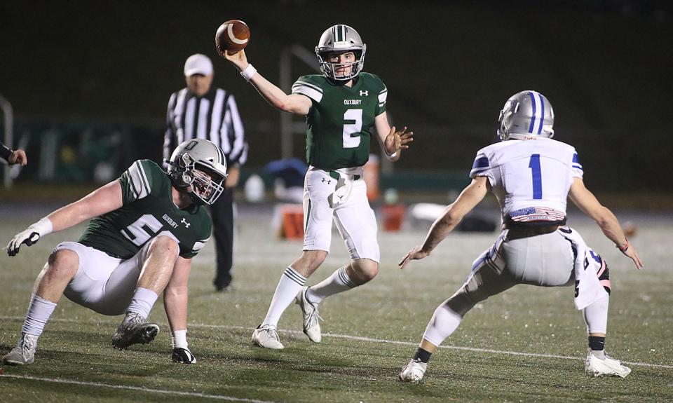 Dragons Matt Festa gets off a pass under pressure.Duxbury hosted Danvers football in MIAA playoff action on Friday November 12, 2021 