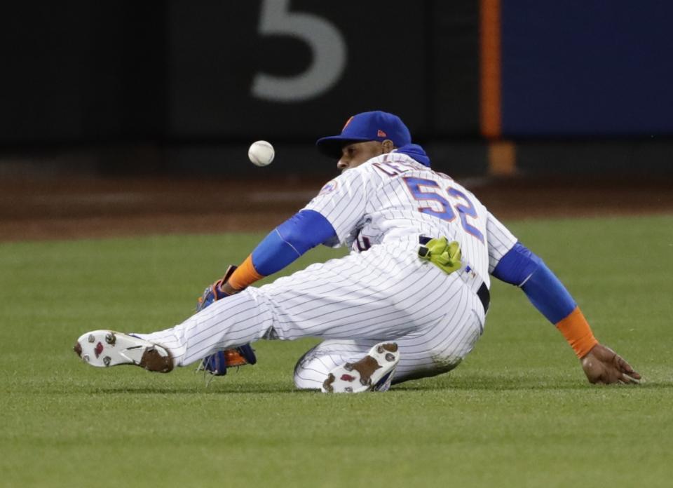 Yoenis Cespedes left Thursday's game against the Philadelphia Phillies in the sixth inning with a hamstring injury (AP Photo/Frank Franklin II).