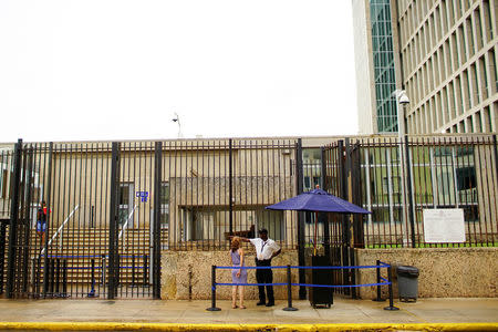 A woman asks for information at the entrance of the U.S. Embassy in Havana, Cuba, September 29, 2017. REUTERS/Alexandre Meneghini