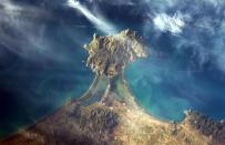 Hadfield captured a view of the Italian coast using one of the International Space Station's Nikon cameras. ' like a diamond set in a ring,' he Tweeted.