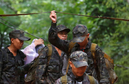 Soldiers work near Tham Luang caves during a search for 12 members of an under-16 soccer team and their coach, in the northern province of Chiang Rai, Thailand, June 27, 2018. REUTERS/Soe Zeya Tun