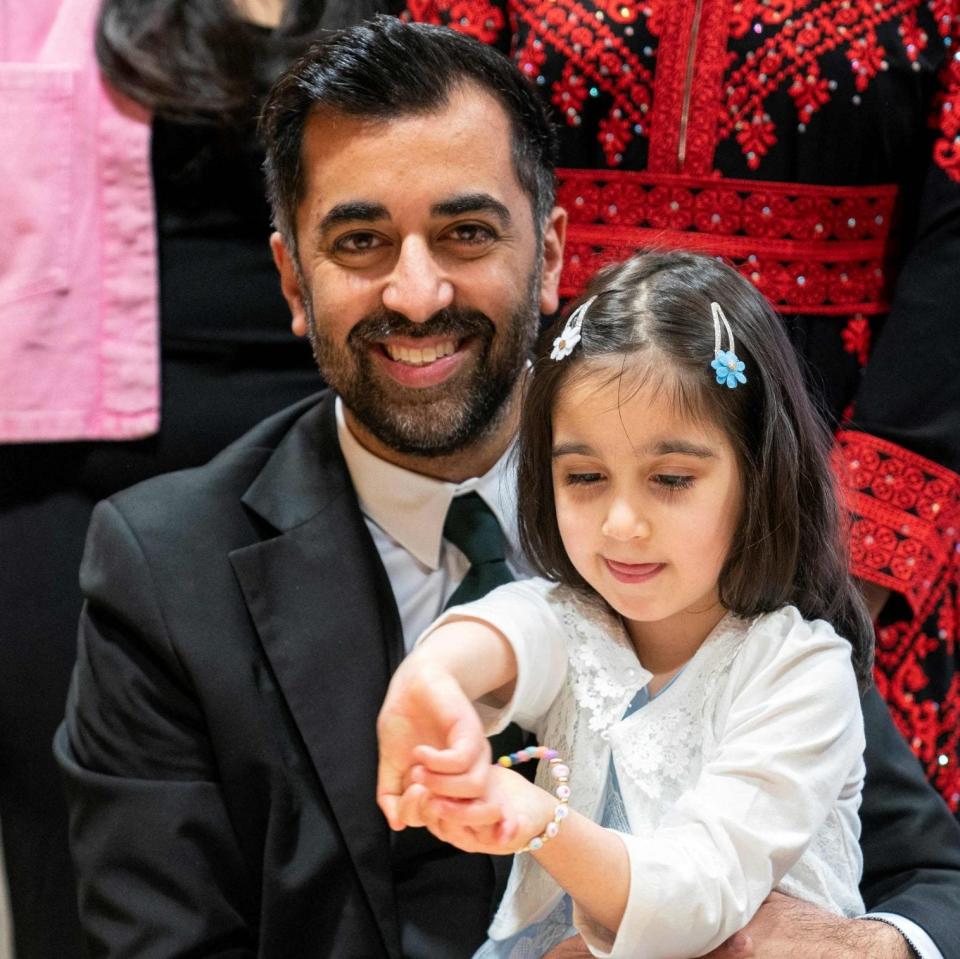 Mr Yousaf with his daughter Amal after signing the nomination form to become First Minister for Scotland - JANE BARLOW