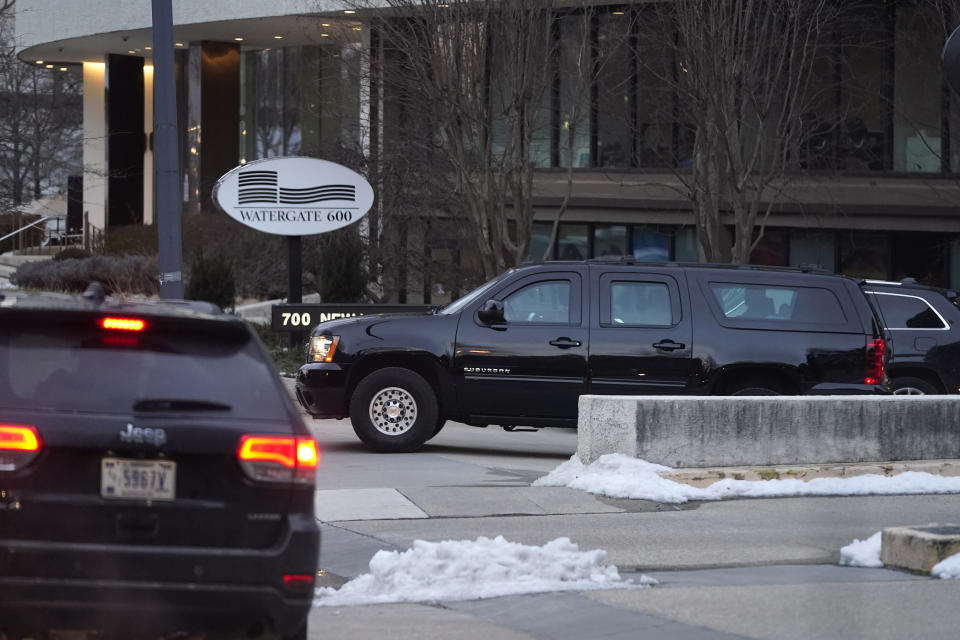 President Joe Biden's motorcade departs the Watergate complex after Biden made a stop to visit with former Sen. Bob Dole, Saturday, Feb. 20, 2021, in Washington. (AP Photo/Patrick Semansky)