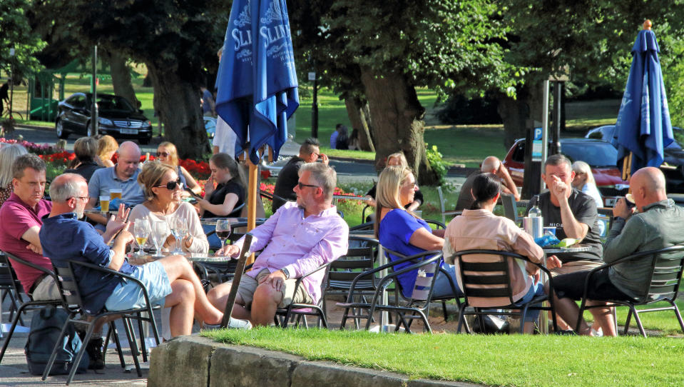  People socialise at a table outside a bar&restaurant during the �Eat Out To Help Out� scheme. UK Chancellor Rishi Sunak's �Eat Out To Help Out� scheme has been used over 10 million times in its first week. Diners receive a 50\% discount, up to �10 each, on food or non-alcoholic drinks every Monday, Tuesday and Wednesday during August. The scheme is to help boost the ailing hospitality industry which has been hard hit during the coronavirus pandemic. (Photo by Keith Mayhew / SOPA Images/Sipa USA) 