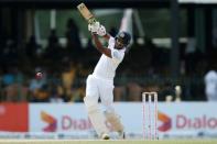 Cricket - Sri Lanka v South Africa - Second Test Match - Colombo, Sri Lanka - July 21, 2018 - Sri Lanka's Danushka Gunathilaka hits a boundary. REUTERS/Dinuka Liyanawatte