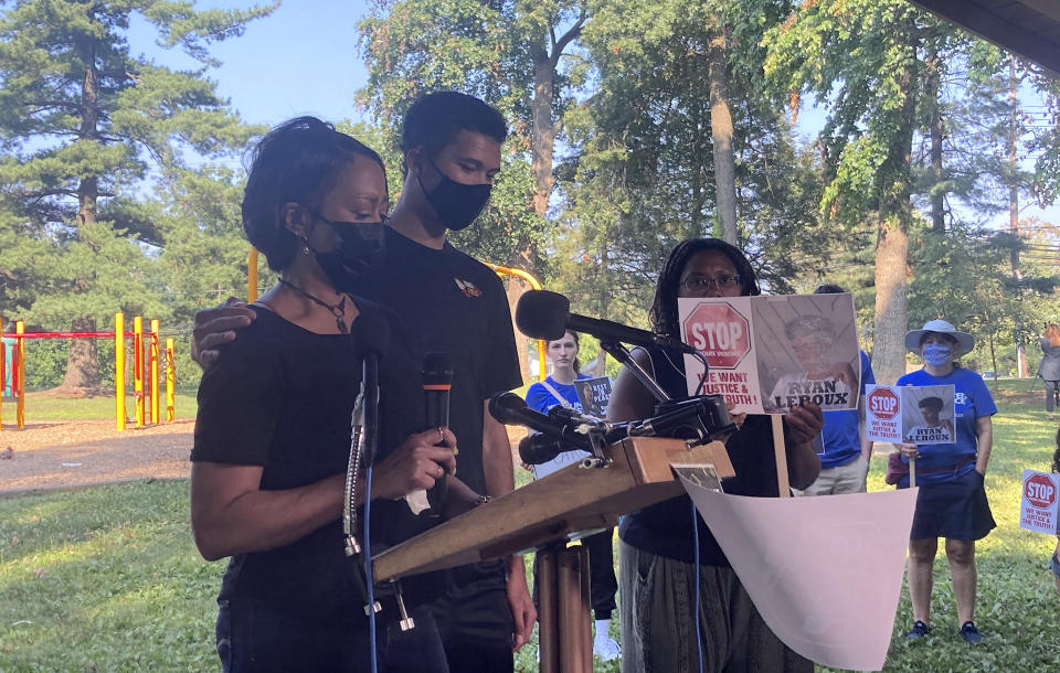 Rhonda LeRoux, left, speaks to reporters about the killing of her 21-year-old son, Ryan LeRoux, by police outside a McDonald’s in Montgomery County, Maryland, on July 16 in Gaithersburg, Md. Ryan’s 19-year-old brother, Matt LeRoux is to her right. (AP Photo/Michael Kunzelman)