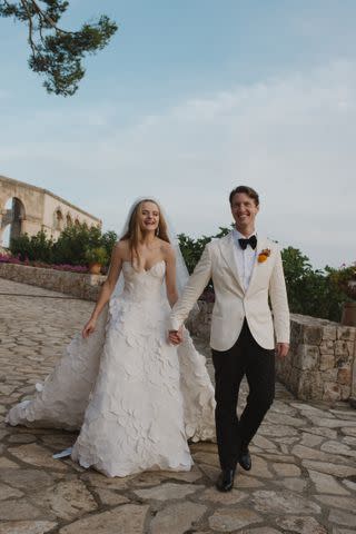 <p>Norman & Blake</p> The bride wore Oscar de la Renta throughout the course of the weekend.