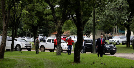 Officials leave after attending a meeting with Paraguay's President Horacio Cartes (not pictured) in the presidential residence in Asuncion, Paraguay April 3, 2017. REUTERS/Jorge Adorno