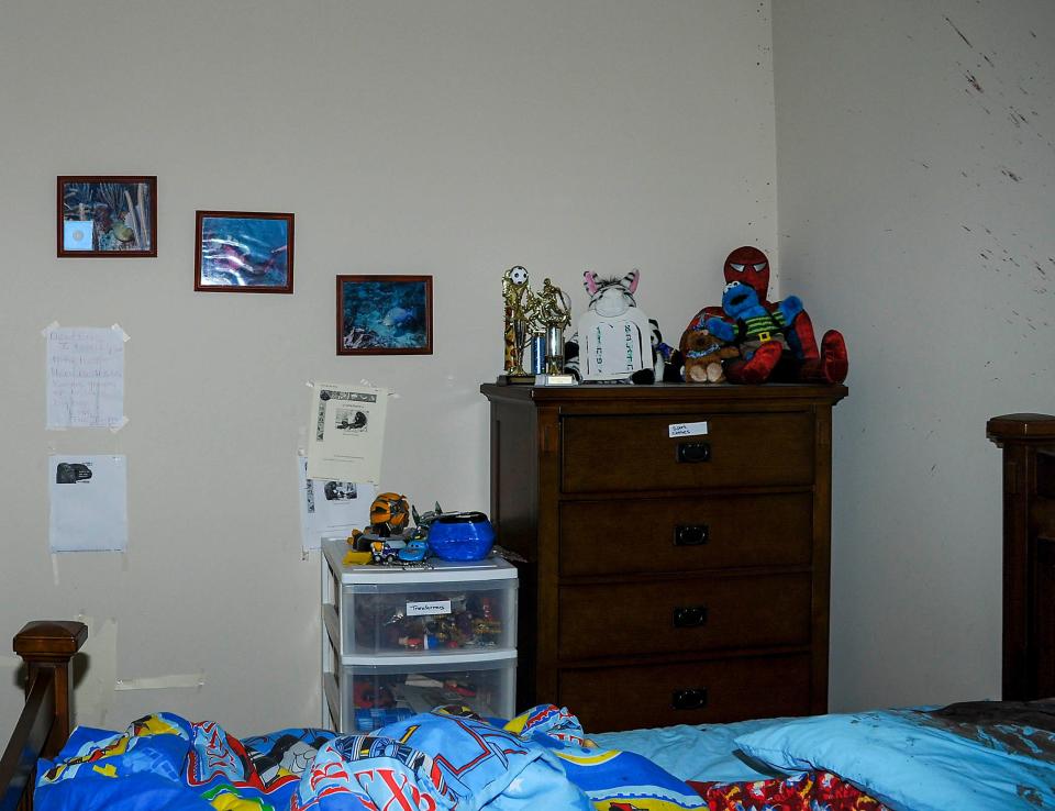 The blood and blood spatter (highlighted) in Eric Jacobson’s bedroom.