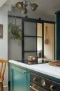 <p>Improve the flow of a small kitchen by installing clever sliding doors on castors. 'Sliding doors are a great space-saving design feature, and offer a clever way to contain cooking smells as well as creating a broken-plan kitchen layout,' says Al.</p><p>Pictured: <a href="https://www.oliveandbarr.com" rel="nofollow noopener" target="_blank" data-ylk="slk:Bespoke kitchen by Olive & Barr;elm:context_link;itc:0;sec:content-canvas" class="link ">Bespoke kitchen by Olive & Barr</a></p>