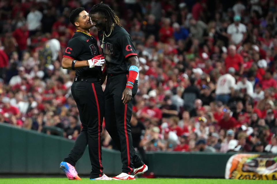 Reds rookies Elly De La Cruz and Noelvi Marte celebrate the tying run in Friday's fifth inning.