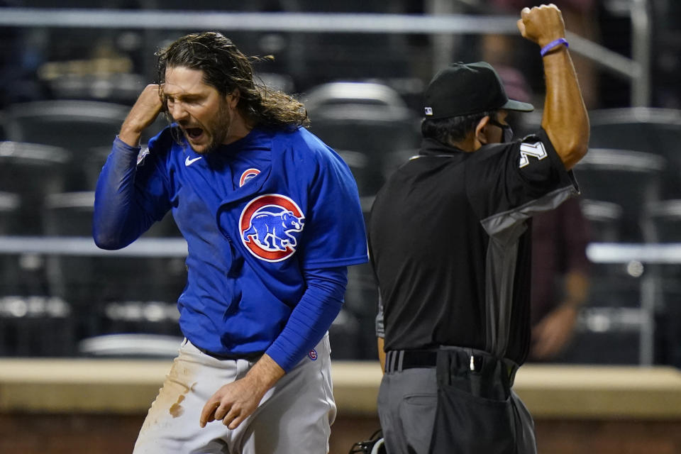 Chicago Cubs' Jake Marisnick, left, reacts after being tagged out at home plate during the ninth inning of the team's baseball game against the New York Mets on Tuesday, June 15, 2021, in New York. (AP Photo/Frank Franklin II)