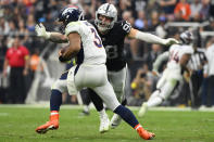 Denver Broncos quarterback Russell Wilson (3) is sacked by Las Vegas Raiders defensive end Maxx Crosby (98) during the second half of an NFL football game, Sunday, Oct. 2, 2022, in Las Vegas. (AP Photo/David Becker)