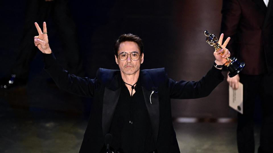 PHOTO: Robert Downey Jr. accepts the award for Best Actor in a Supporting Role for 'Oppenheimer' onstage during the 96th Annual Academy Awards, in Hollywood, Mar. 10, 2024. (Patrick T. Fallon/AFP via Getty Images)