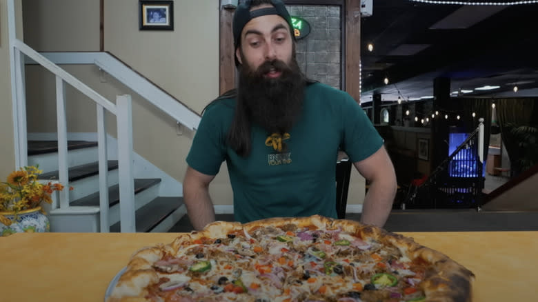 Adam Moran looks at pizza