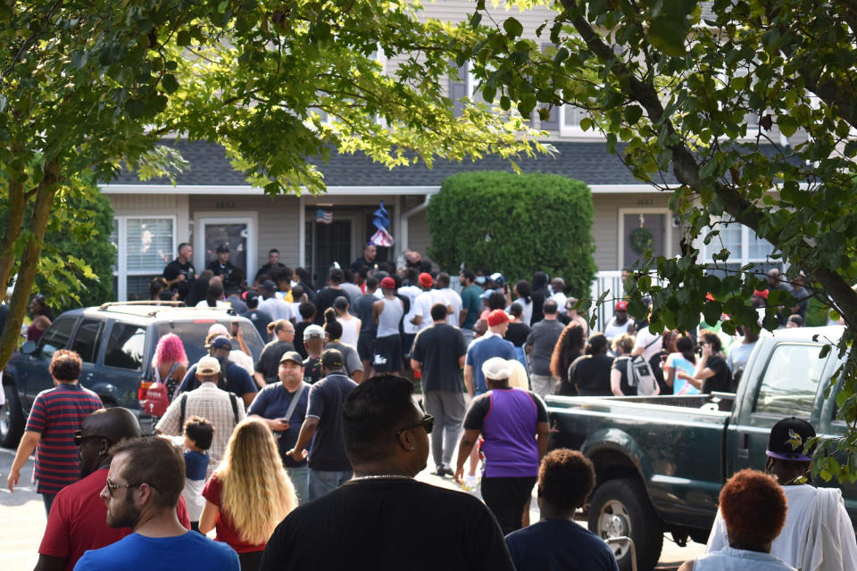 A crowd forms in front of the house of Edward Mathews, which is blocked by police. (Jim Walsh / Courier-Post via USA TODAY NETWORK)