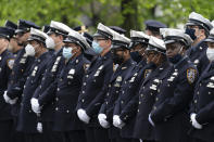 Police officers line the street as the funeral procession of New York police officer Anastasios Tsakos leaves the St. Paraskevi Greek Orthodox Shrine Church, Tuesday, May 4, 2021, in Greenlawn, N.Y. Tsakos was at the scene of an accident on the Long Island Expressway when he was struck and killed by an allegedly drunk driver a week ago. (AP Photo/Mark Lennihan)