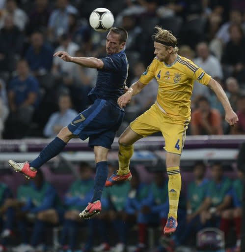 French midfielder Franck Ribery (L) jumps for the ball with Ukrainian midfielder Anatoliy Tymoshchuk during the Euro 2012 championships football match at the Donbass Arena in Donetsk. France won 2-0