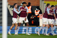 Aston Villa's scorer Jack Grealish, left, and his teammates celebrate the opening goal during the English Premier League soccer match between FC Fulham and Aston Villa in London, England, Monday, Sept. 28, 2020. (Will Oliver/Pool via AP)