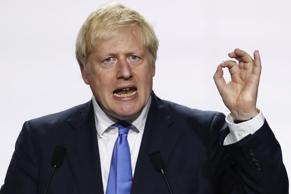 FILE - In this Monday, Aug. 26, 2019 file photo, Britain's Prime Minister Boris Johnson gestures during his final press conference at the G7 summit in Biarritz, southwestern France. Boris Johnson is getting tough with members of his Conservative Party who oppose his Brexit plans at the start of what promises to be a momentous week in British politics. The so-called "rebels" are being warned Monday Sept. 2, 2019, that they will be expelled from the party if they take part in efforts led by opposition parties in Parliament meant to block a departure from the European Union without a deal. (AP Photo/Francois Mori, File)