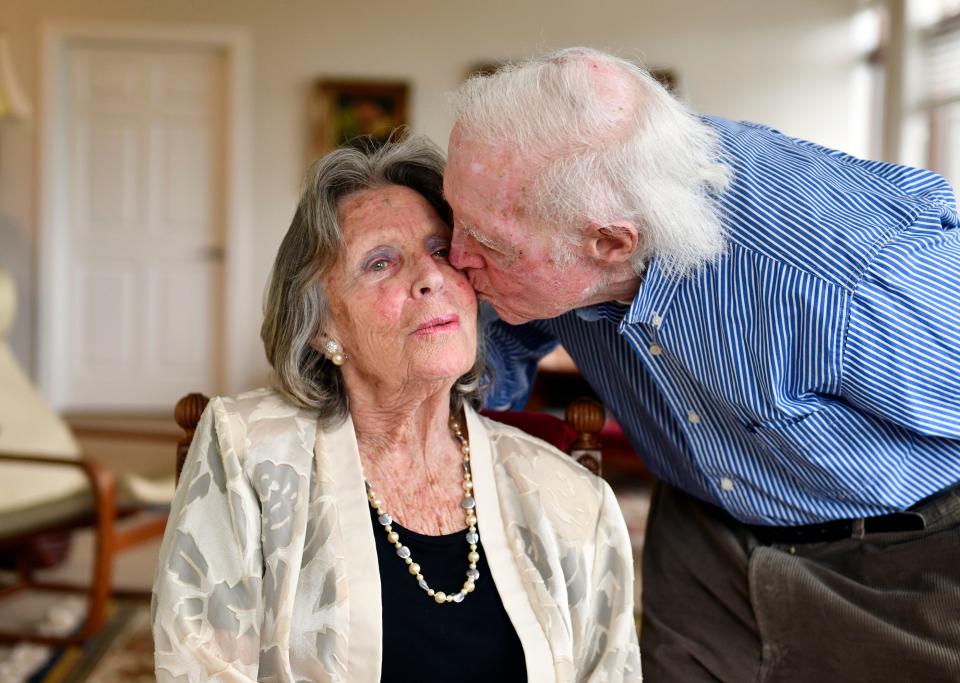 Burlington County Times columnist Sally Friedman gets a kiss from her husband Victor in their Philadelphia apartment. Friedman has shared her life in words during a 50-year career. May 20, 2022.