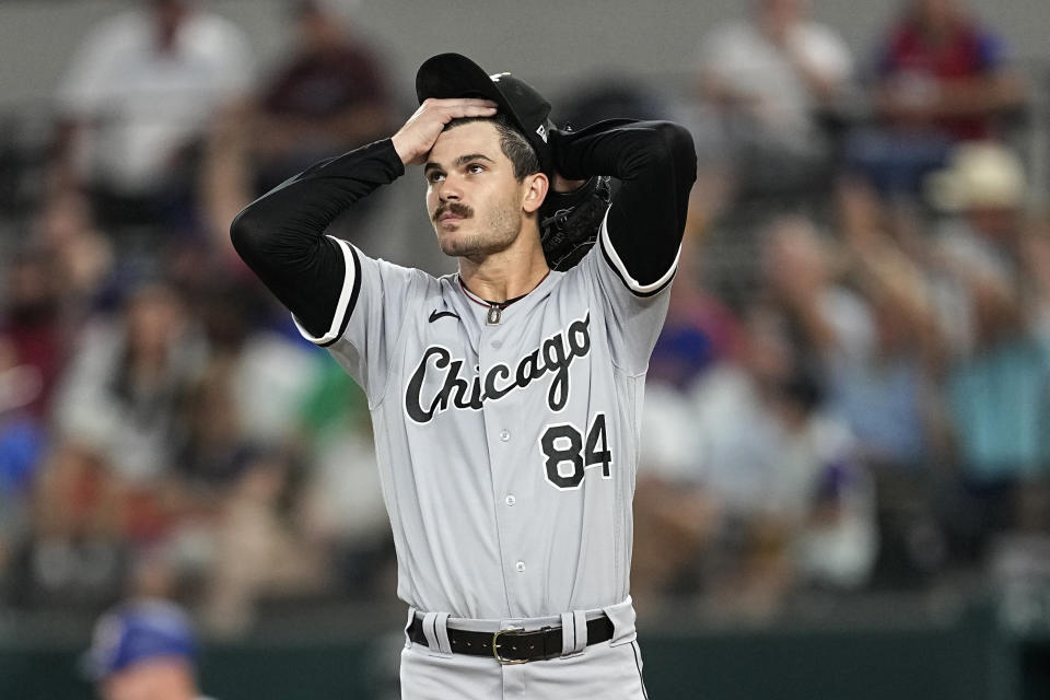 Chicago White Sox starting pitcher Dylan Cease adjust his cap as he stands on the mound after giving up a two-run double to Texas Rangers' Travis Jankowski in the second inning of a baseball game, Wednesday, Aug. 2, 2023, in Arlington, Texas. (AP Photo/Tony Gutierrez)