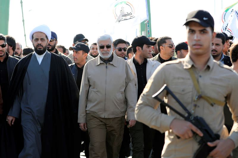 Qais al-Khazali and Abu Mahdi al-Muhandis attend a funeral procession of Hashd al-Shaabi members in Baghdad