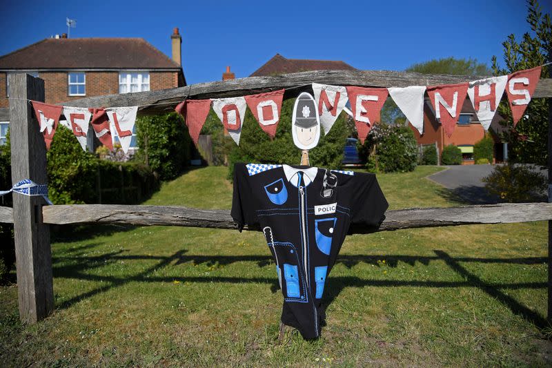 Scarecrows representing key workers lighten the daily lockdown walk, as the number of the coronavirus disease cases (COVID-19) grows around the world, in the village of Capel