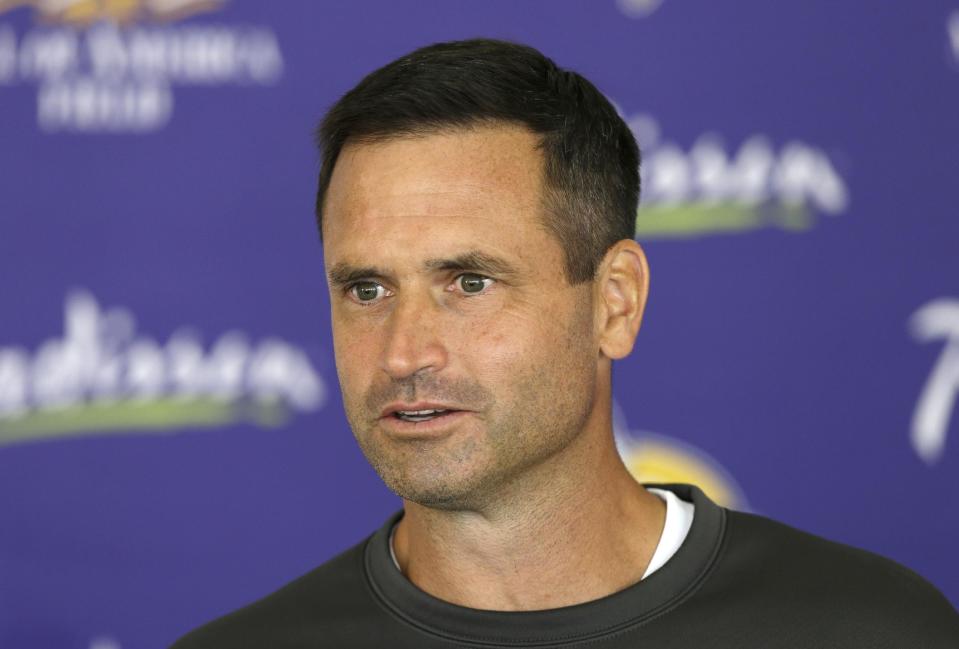 In this July 27, 2013, photo, Minnesota Vikings special teams coordinator Mike Priefer speaks to reporters following practice at NFL football training camp in Mankato, Minn. Former Minnesota punter Chris Kluwe says Priefer made anti-gay comments while Kluwe was with the Vikings. Kluwe wrote a scathing article on the website Deadspin on Thursday, Jan. 2, 2014. In it, he alleges that Priefer made several anti-gay comments in objection to Kluwe's outspoken support of a gay marriage amendment in Minnesota. Kluwe also said coach Leslie Frazier and general manager Rick Spielman encouraged him to tone down his public rhetoric on gay marriage and several other issues. Kluwe was cut last summer and did not play in the NFL this season. The Vikings issued a statement saying they take the allegations seriously. They also say he was released because of his football performance, not something else. (AP Photo/Charlie Neibergall)