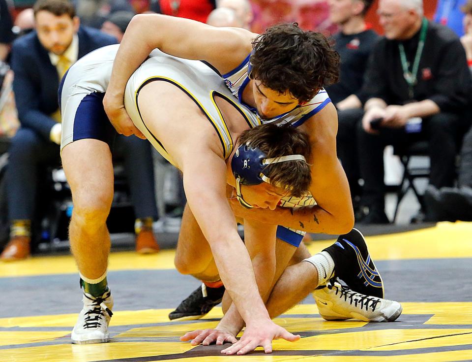 Mapleton’s Brock Durbin wrestles Archbold’s Brodie Dominique during their 144lbs Division III championship match at the OHSAA State Wrestling Championships Sunday, March 10, 2024 at the Jerome Schottenstein Center. TOM E. PUSKAR/MANSFIELD NEWS JOURNAL