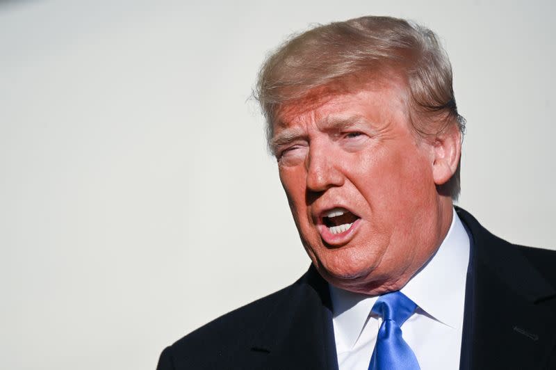 U.S. President Donald Trump speaks to reporters before departing the White House en route to Florida