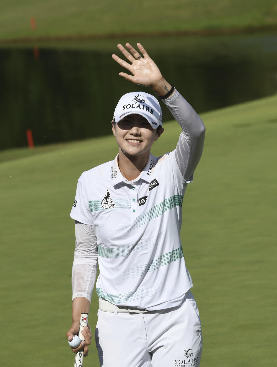 Sung Hyun Park waves to fans after sinking her final putt to win the LPGA Walmart NW Arkansas Championship golf tournament, Sunday, June 30, 2019, in Rogers, Ark. (AP Photo/Michael Woods)