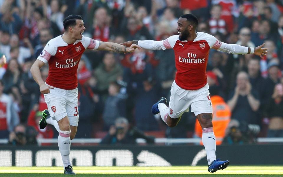 Alexandre Lacazette celebrates his opening goal against Southampton at the Emirates - REUTERS