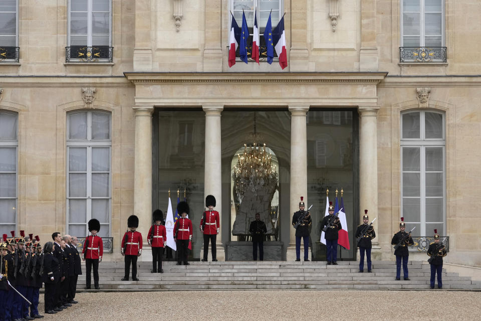 British soldiers and Republican Guards stand guard at the Elysee Palace, Monday, April 8, 2024 in Paris. Sixteen soldiers from No 7 Company Coldstream Guards and 32 members of the Gendarmerie Garde Republicaine mount guard at the Elysee palace as British troops join French guards in a special ceremony at the Elysee Palace to celebrate 120 years of "entente cordiale" between the longtime rival powers. (AP Photo/Thibault Camus, Pool)