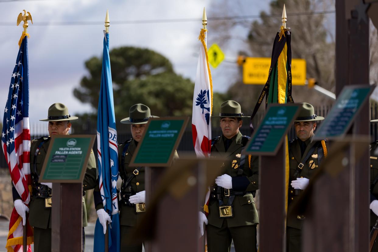 The El Paso Sector Honor Guard Drill Team stand behind a memorial honoring fallen agents on Wednesday, Jan. 24, at the El Paso Sector Headquarters.