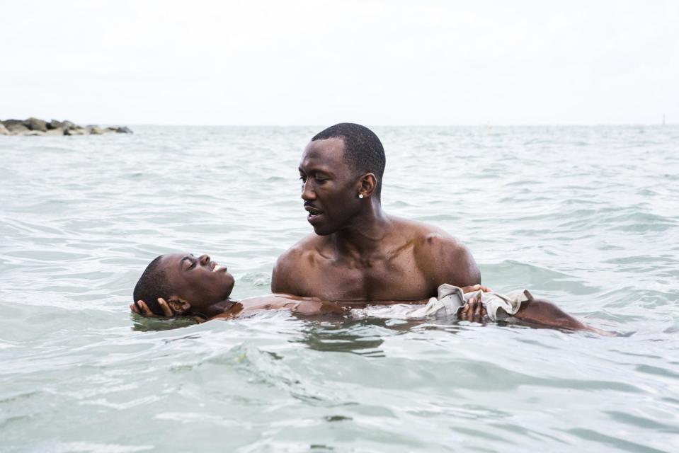 This image released by A24 shows Alex Hibbert, foreground, and Mahershala Ali in a scene from the film, "Moonlight." The Producers Guild of America has nominated awards season favorites “La La Land,” “Moonlight” and “Manchester by the Sea” for its top award, as well as the R-rated superhero film “Deadpool.” Winners will be announced in a Jan. 28 ceremony in Beverly Hills, Calif. (David Bornfriend/A24 via AP)