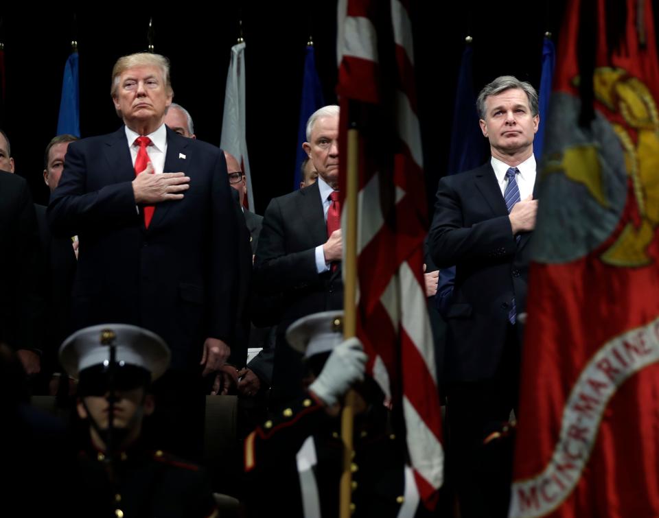 President Donald Trump, then-Attorney General Jeff Sessions, center and FBI Director Christopher Wray in 2017.